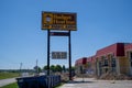 Sign for a Budget Host Inn with vacancy, a cheap motel chain known for low rates