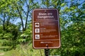 Mankato, Minnesota - June 5, 2020: Sign warning hikers about dangerous bison wildlife, with a list of rules to follow for safety
