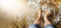 A manl with yellow slippers  jumps into the glassy puddle on the empty road after hard rainfall. Crystal clear water splashes with Royalty Free Stock Photo