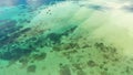 Manlawi Sandbar floating cottages in Caramoan Islands. A lagoon with floating crotches, top view.