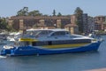 MANLY, AUSTRALIA-DECEMBER 19TH 2013: The Manly Fast Ferry leaving Manly harbour for Circular Quay. The fast ferry competes the Royalty Free Stock Photo