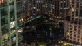 Manmade lake and residential buildings in Greens neighbourhood night timelapse in Dubai, UAE