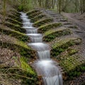 A manmade waterfall in Haigh Woodlands Park, Haigh Plantations, Wigan, Greater Manchester