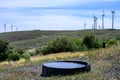 Manmade watering hole for wildlife on a high desert wind farm Royalty Free Stock Photo