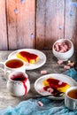 Manne cake with raspberry jam on a white plate. Tea party. Royalty Free Stock Photo