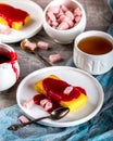 Manne cake with raspberry jam on a white plate. Tea party. Royalty Free Stock Photo