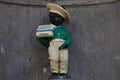 Brussels, Belgium - Closeup photo with a dressed statue of Manneken Pis seen close to the Grand Place