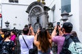 Manneken pis fountain with tourists