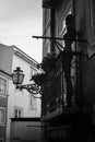 Mannequin on the balcony. Lisbon. Portugal. Black and white. Royalty Free Stock Photo