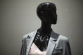 Mannequin is black. Figure of woman in jacket. Window of clothing store Royalty Free Stock Photo