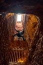 A mannequin climbing a mine shaft in Old Timers Mine & Museum, Coober Pedy, South Australia