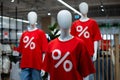 Mannequin in a clothing store in a red t-shirt with a percent sign Royalty Free Stock Photo