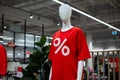 Mannequin in a clothing store in a red t-shirt with a percent sign Royalty Free Stock Photo