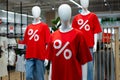 Mannequin in a clothing store in a red t-shirt with a percent sign Royalty Free Stock Photo