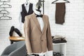 Mannequin with custom tailored jacket and shirt in atelier