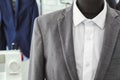 Mannequin with custom tailored suit and shirt in atelier, closeup