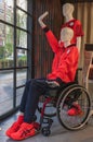 Mannequin depicting a disabled supporter of Japan Paralympic Team sitting on a wheelchair.