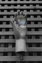 Mannequin doll hand holding crystal ball with colorful reflections