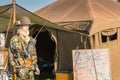 Mannequin dressed in military front of a tent Royalty Free Stock Photo