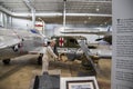 A mannequin dressed in a sailor suit behind a gun surrounded by airplanes and a truck at USS Alabama Battleship Memorial Park Royalty Free Stock Photo