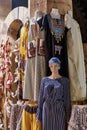 Mannequin of girl in dress and oriental headdress with coins,colorful Egyptian female dresses