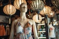 mannequin in halter neck summer dress, decorative lanterns above