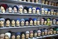 Mannequin heads in knitted hats and scarves. Mannequins female heads in hats and scarfs close up. Woolen knitted caps Royalty Free Stock Photo