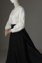 A mannequin with human hands dressed as a Victorian woman wearing a linen garibaldi blouse and black skirt Royalty Free Stock Photo