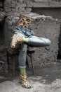 Mannequin legs in jeans and rubber galoshes from the top is a bin, a creative installation