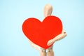 Mannequin man holding a red heart. Love symbol. Happy Valentine`s Day Greeting Card, Mother`s Day, Birthday Royalty Free Stock Photo
