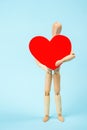 Mannequin man holding a red heart. Love symbol. Happy Valentine`s Day Greeting Card, Mother`s Day, Birthday Royalty Free Stock Photo