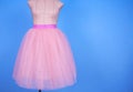 Mannequin in pink princess skirt on blue background Royalty Free Stock Photo