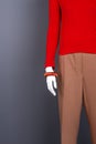 Mannequin with red sweater and bracelet.