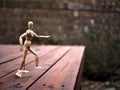 Artist`s Articulating Wood Drawing Mannequin on Wooden Deck Royalty Free Stock Photo