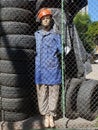 mannequin is used in parking lot to sell tires