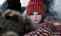 mannequin wearing a bright red knit cap