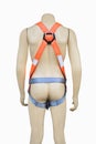 Mannequin wearing construction safety belt on isolated background.