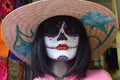 Mannequin wearing fantastic colorful festive makeup and a hat for DÃÂ­a de Muertos in Mexico, catrina makeup 