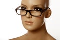 Mannequin wearing spec reading glasses on white