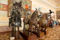 Mannequins of ancient knights in armor on horses