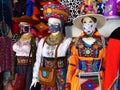 Mannequins dressed in national costumes and protective masks