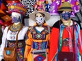 Mannequins dressed in national costumes and protective masks