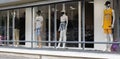 Mannequins, male and female, in a brand fashion store, with a medical mask designed during the coronavirus crisis. New fashion