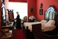 Mannequins in period clothes in red bedroom set for sleeping, Saratoga Springs, New York, Canfield Casino, 2018