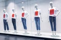 Mannequins On A Shop Window In A Shopping Center In Mocap Undershirts And Jeans. Sell-out