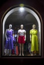 Mannequins at shopfront. Boutique window with dressed mannequins. Fashionable brand window display