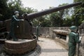 Mannequins of soldiers manipulating a large cannon at Cannon Fort in Cat Ba, Vietnam