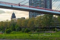 Mannheim, Germany. April 26th, 2010. The west bank of the Neckar river with the riverside park, the pedestrian bridge and the