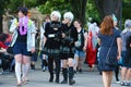 Cosplayers from computer game called `Nier Automata`walking though public park in in Mannheim during anual anime and manga convent