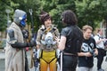 Cosplayers from game `Overwatch` in public park in front of water tower in Mannheim during anual anime and manga convention